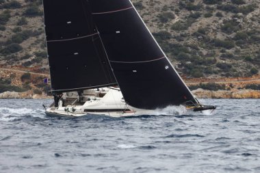 Bodrum,Turkey. 05 February 2023: Sailboats sail in windy weather in the blue waters of the Aegean Sea, on the shores of the famous holiday destination Bodrum.