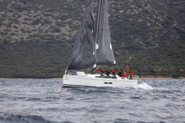 Bodrum,Turkey. 05 February 2023: Sailboats sail in windy weather in the blue waters of the Aegean Sea, on the shores of the famous holiday destination Bodrum.