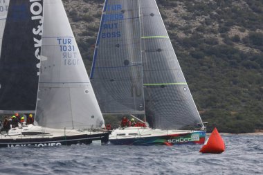 Bodrum,Turkey. 05 February 2023: Sailboats sail in windy weather in the blue waters of the Aegean Sea, on the shores of the famous holiday destination Bodrum.