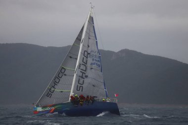 Bodrum,Turkey. 05 February 2023: Sailboats sail in windy weather in the blue waters of the Aegean Sea, on the shores of the famous holiday destination Bodrum.