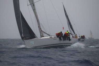 Bodrum,Turkey. 05 February 2023: Sailboats sail in windy weather in the blue waters of the Aegean Sea, on the shores of the famous holiday destination Bodrum.