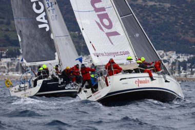 Bodrum,Turkey. 05 February 2023: Sailboats sail in windy weather in the blue waters of the Aegean Sea, on the shores of the famous holiday destination Bodrum.