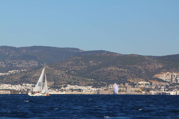 Bodrum,Turkey. 09 February 2020: Sailboats sail in windy weather in the blue waters of the Aegean Sea, on the shores of the famous holiday destination Bodrum.