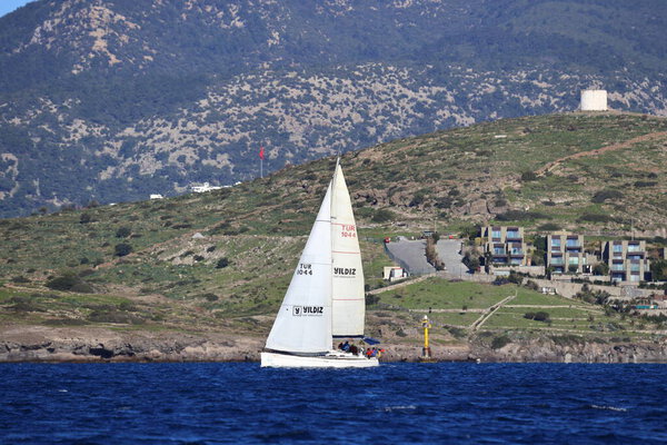 Bodrum,Turkey. 14 January 2024: Sailboats sail in windy weather in the blue waters of the Aegean Sea, on the shores of the famous holiday destination Bodrum.