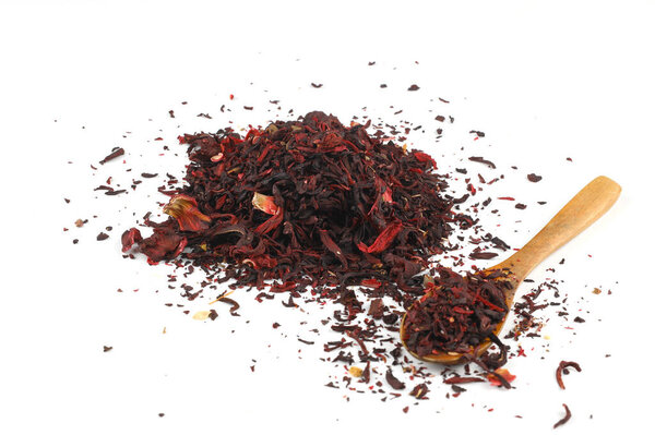 Hibiscus, a pile of red dried Hibiscus tea leaves. Karkade tea. On white background. View from above.