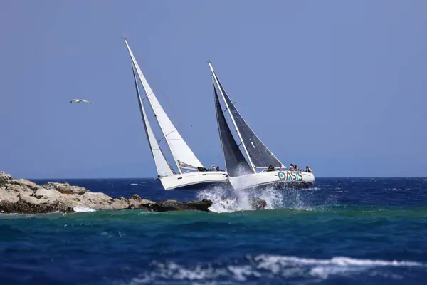 stock image Bodrum,Turkey. 25 May 2024: Sailboats sail in windy weather in the blue waters of the Aegean Sea, on the shores of the famous holiday destination Bodrum.