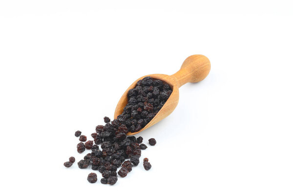 raisins in a scoop isolated on white background