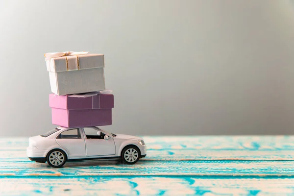 stock image white car and gift boxe