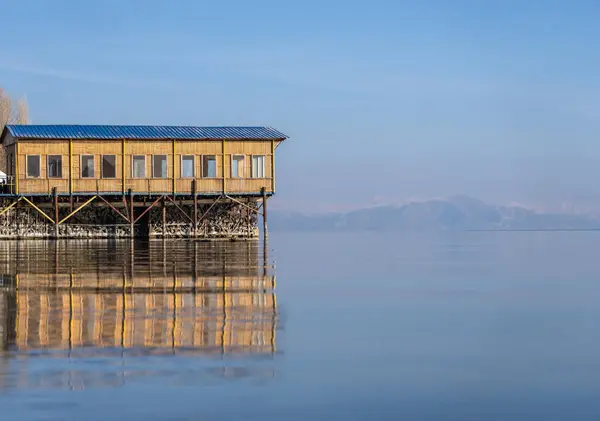 Wooden house on the lake during the da