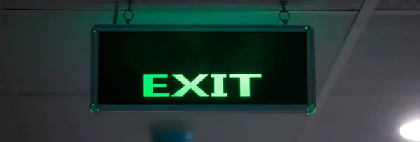Fire exit sign at the corridor in buildin
