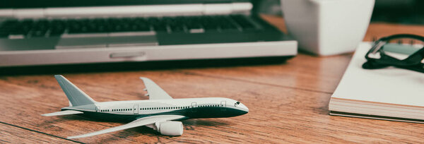Top view of airplane model on laptop