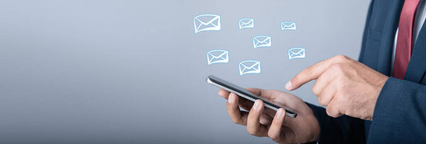 businessman hands using phone with digital email ico