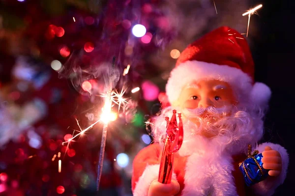 Santa Claus Toy Sparkler Holiday Christmas Background — Stock Photo, Image