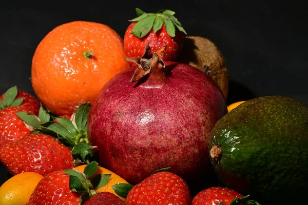 assortment of fruits on a black background