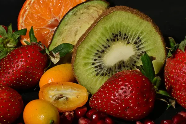 assortment of fruits on a black background
