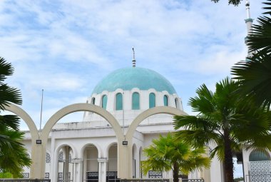 Mosque in Kuching Malaysia on blue sky.