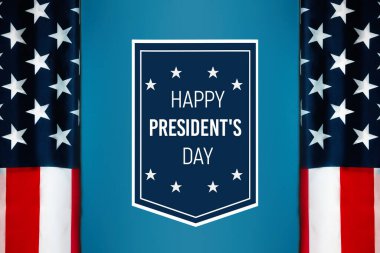 National holidays of United States of America. NAvy blue sign with congratulations Happy president's day with flag of the USA on blue background. Flat lay. Concept of patriotism.