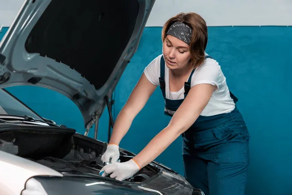 Young Woman Mechanic Coveralls Gloves Repairs Engine Mock Copy Space — Zdjęcie stockowe