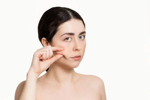 Portrait Woman Pulling Skin Her Face Her Fingers White Background — Stockfoto