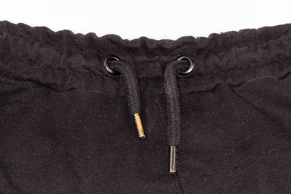 Siyah Örülmüş Pantolonun Bir Parçası Göz Bebekleri Ile Güçlendirilmiş Metal — Stok fotoğraf