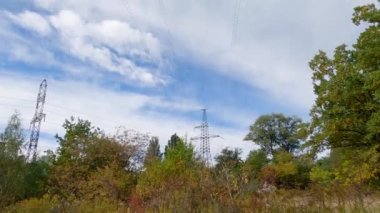 Wire conductors of the overhead power line against the sky