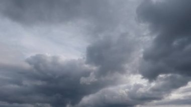 Sky with storm clouds above trees while panning