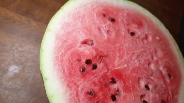 Half of watermelon on the table, top view close-up