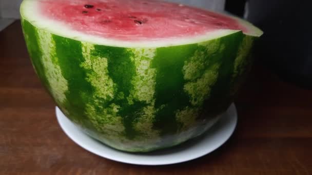 Half Green Striped Watermelon Table While Panning — 图库视频影像