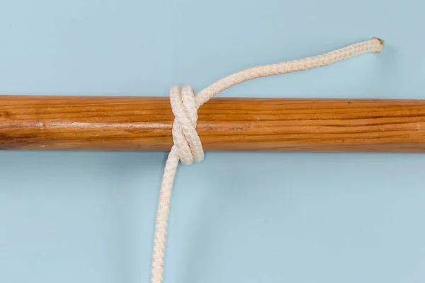 Tightened Rope Strangle Knot Tied Wooden Pole View Blue Background — Zdjęcie stockowe