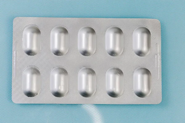 Cały Blister Foliowy Tabletkami Leku Widok Góry Niebieską Powierzchnię — Zdjęcie stockowe
