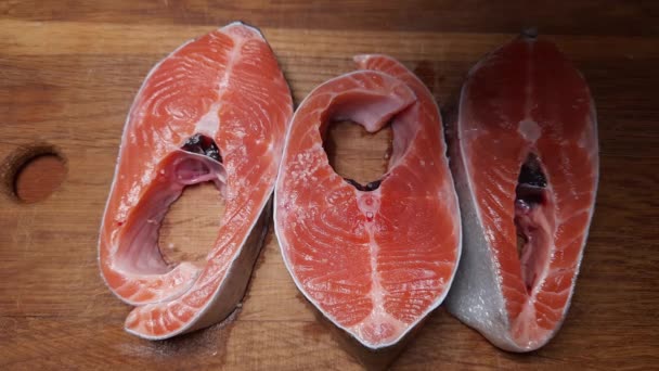Sprinkling Salt Pieces Rainbow Trout Cutting Board — Stock Video