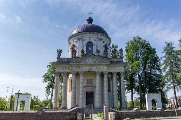 Baroque Roman Catholic church of St. Joseph built in the 18th with inscription in Latin on main facade - TO THE GLORY OF OUR LORD GOD, Pidhirtsi village, Ukraine
