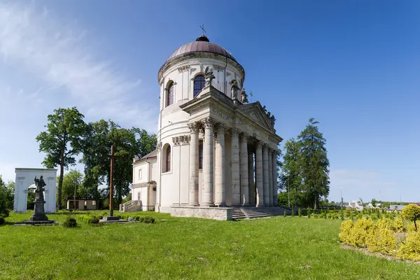 Baroque Roman Catholic church of St. Joseph built in the 18th with inscription on main facade translated from Latin - TO THE GLORY OF OUR LORD GOD, Pidhirtsi village, Ukraine