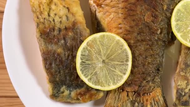 Fried Carp Pieces Lemon Dish Rustic Table — Stock Video