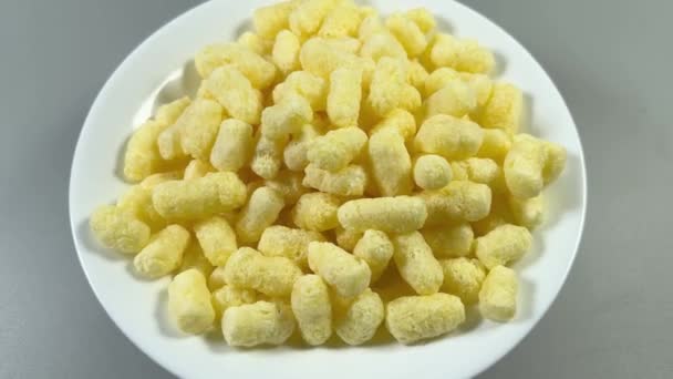 Sweet Corn Puffs White Plate Gray Background — Stock Video