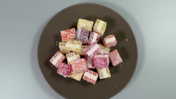 Piece Multicolored Layered Fruit Jelly Candies Sprinkled Flaked Coconut — Stock Video
