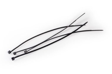 Several black unfastened single-use nylon cable ties on a white background clipart