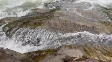 Probiy waterfall on Prut River in Carpathians in overcast day