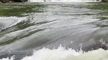 Probiy waterfall on Prut River in Carpathians in overcast day