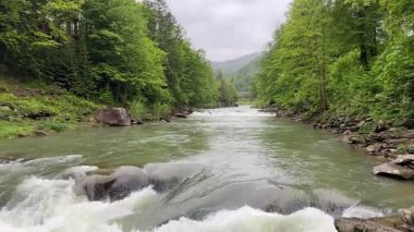 Probiy waterfall on Prut River in Carpathians in overcast day