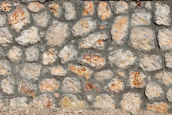 Una Hermosa Textura Una Vieja Pared Piedras Anaranjadas Con Grietas — Foto de Stock