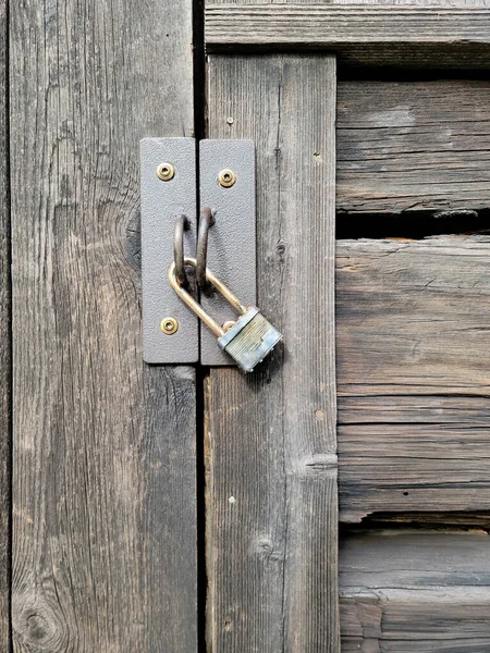 Closeup Weathered Padlock Old Wooden Door — Stock Photo, Image
