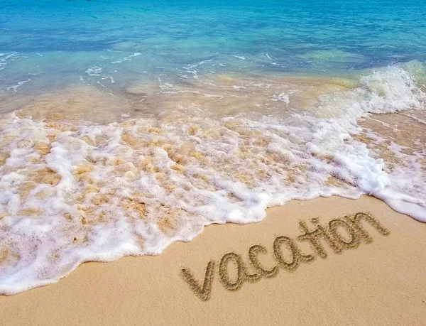 Vacation Text Beach Sand Frothy Ocean Water — Stok fotoğraf