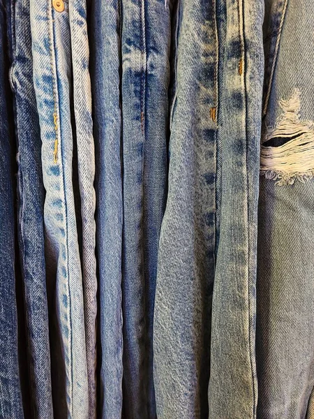 Closeup of distressed blue jeans