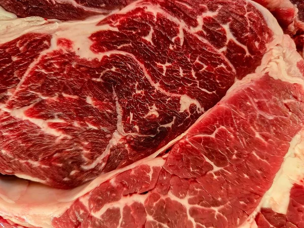 Closeup of raw beef marbled with fat