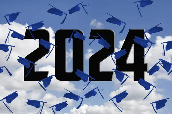 Airborne Blue Graduation Caps 2024 Sky White Clouds lizenzfreie Stockbilder