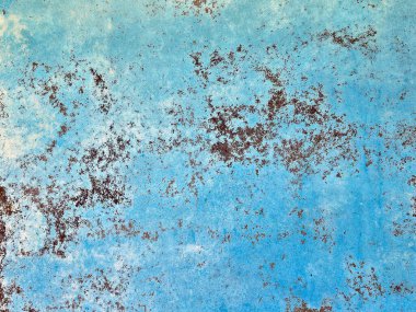 Paslı benekli, soluk mavi boya yakın plan.