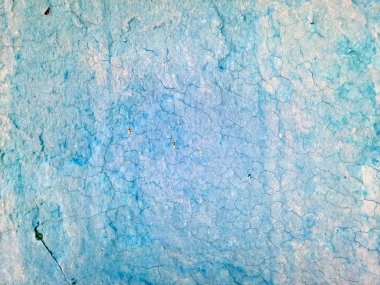 A turquoise and blue surface features a cracked and weathered appearance suggesting it may be old and exposed to the elements  clipart