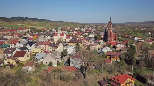 Panorama from a bird\'s eye view. Central Europe: The Polish town of Kolaczyce is located among the green hills. Temperate climate. Flight drones or quadrocopter. aerial view of a tourist city.