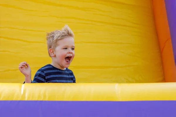 Little Boy Having Fun Inflatable Castle Playground Furious Child Shouts — Stockfoto